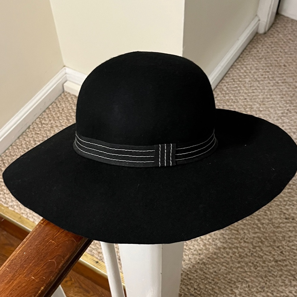 Black wool fedora with black and white seamed ribbon detail.